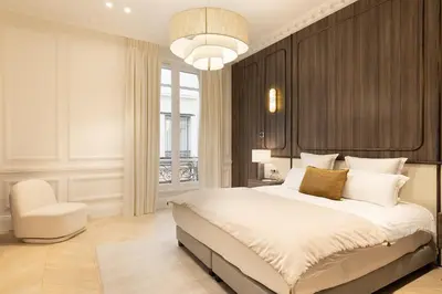 Un ou plusieurs lits dans un hébergement de l'établissement Maison Galante - Serviced Apartments in Champs-Elysées