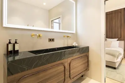 Un ou plusieurs lits dans un hébergement de l'établissement Maison Galante - Serviced Apartments in Champs-Elysées