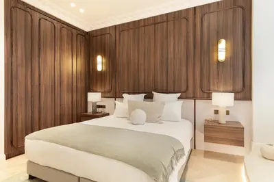 Un ou plusieurs lits dans un hébergement de l'établissement Maison Galante - Serviced Apartments in Champs-Elysées