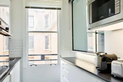 Cuisine ou kitchenette dans l'établissement Splendid Apartment in the Heart of the Chic 16th