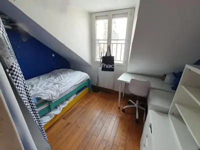 Un ou plusieurs lits dans un hébergement de l'établissement Appartement 5 chambres au dernier étage