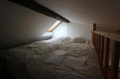 Un ou plusieurs lits dans un hébergement de l'établissement Appartement 5 chambres au dernier étage