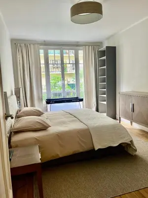 Un ou plusieurs lits dans un hébergement de l'établissement Appart PARIS 16 Auteuil-Passy Standing neuf 2ch 2sdb 2wc