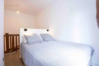 Un ou plusieurs lits dans un hébergement de l'établissement DUPLEX AU COEUR DU 16 Eme