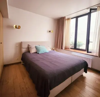 Un ou plusieurs lits dans un hébergement de l'établissement Homeloveparis