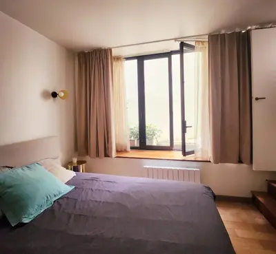 Un ou plusieurs lits dans un hébergement de l'établissement Homeloveparis