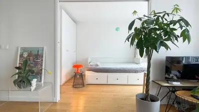 Télévision ou salle de divertissement dans l'établissement Appt 2 Chambres Vue Tour Eiffel