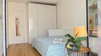 Un ou plusieurs lits dans un hébergement de l'établissement Appt 2 Chambres Vue Tour Eiffel