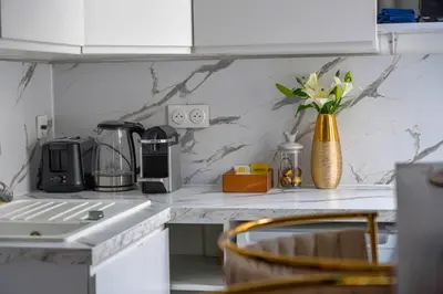 Cuisine ou kitchenette dans l'établissement L'appartement du duc de Choiseul - Coeur Opéra