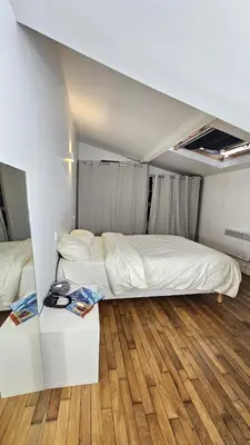Un ou plusieurs lits dans un hébergement de l'établissement Appartement Boulogne-Billancourt