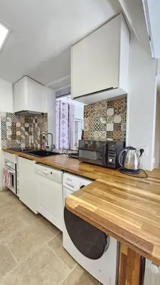 Cuisine ou kitchenette dans l'établissement Appartement Boulogne-Billancourt