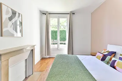 Un ou plusieurs lits dans un hébergement de l'établissement Magnifique et spacieux appartement proche Paris