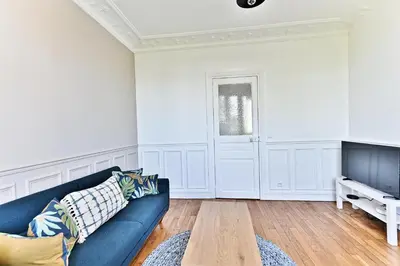 Coin salon dans l'établissement Magnifique et spacieux appartement proche Paris