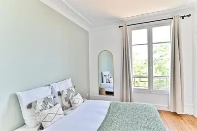 Un ou plusieurs lits dans un hébergement de l'établissement Magnifique et spacieux appartement proche Paris