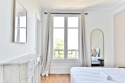 Un ou plusieurs lits dans un hébergement de l'établissement Appartement lumineux Banlieue Parisienne - Puteaux