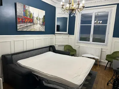 Coin salon dans l'établissement Appartement calme près de La Villette