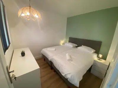 Un ou plusieurs lits dans un hébergement de l'établissement Appartement bassin de la villette