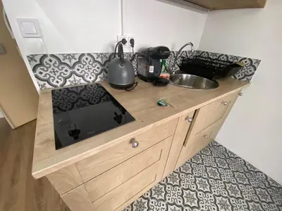 Cuisine ou kitchenette dans l'établissement Appartement bassin de la villette