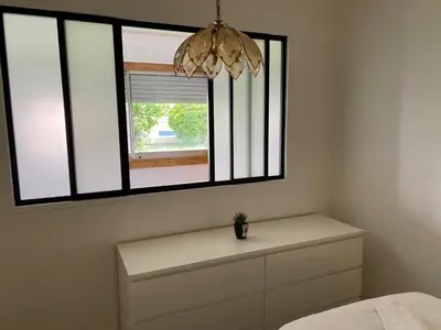 Un ou plusieurs lits dans un hébergement de l'établissement Appartement bassin de la villette