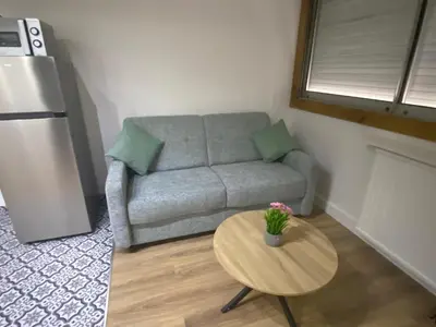 Coin salon dans l'établissement Appartement bassin de la villette