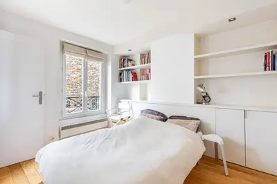 Un ou plusieurs lits dans un hébergement de l'établissement GuestReady - Confort et Élégance au Cœur de Paris