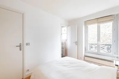 Un ou plusieurs lits dans un hébergement de l'établissement GuestReady - Confort et Élégance au Cœur de Paris