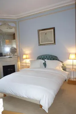 Un ou plusieurs lits dans un hébergement de l'établissement Prestigious 2 bedroom near Champs Elysées