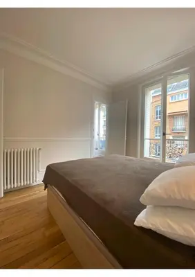 Un ou plusieurs lits dans un hébergement de l'établissement Sunny Bastille-Roquette Paris
