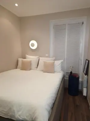 Un ou plusieurs lits dans un hébergement de l'établissement Appartement de charme dans les Batignolles