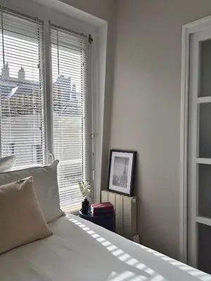 Un ou plusieurs lits dans un hébergement de l'établissement Appartement de charme dans les Batignolles
