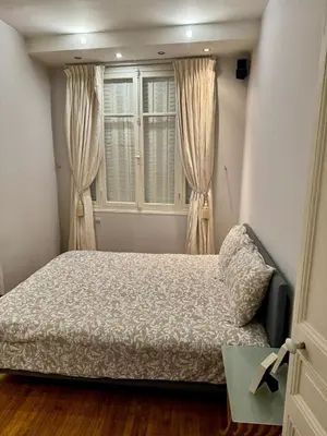Un ou plusieurs lits dans un hébergement de l'établissement Appartement de 2 chambres au cœur de Paris