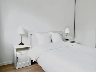 Un ou plusieurs lits dans un hébergement de l'établissement Charmant Appartement au Cœur du 13ème Arrondissement de Paris