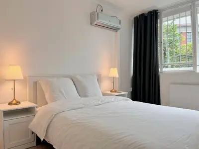Un ou plusieurs lits dans un hébergement de l'établissement Charmant Appartement au Cœur du 13ème Arrondissement de Paris