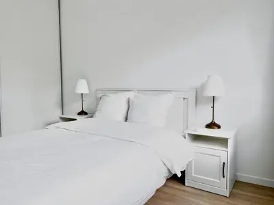 Un ou plusieurs lits dans un hébergement de l'établissement Charmant Appartement au Cœur du 13ème Arrondissement de Paris