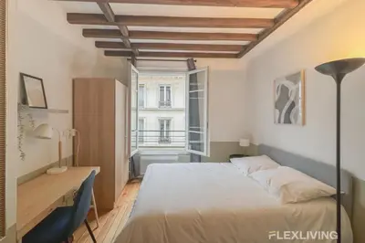 Un ou plusieurs lits dans un hébergement de l'établissement Flexliving - Studio - Échiquier
