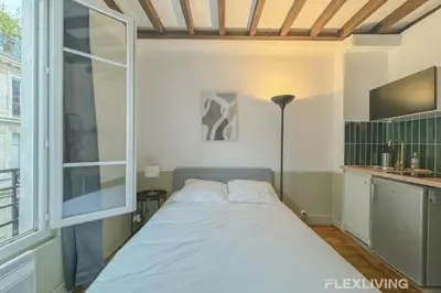 Un ou plusieurs lits dans un hébergement de l'établissement Flexliving - Studio - Échiquier