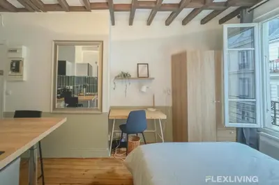 Un ou plusieurs lits dans un hébergement de l'établissement Flexliving - Studio - Échiquier