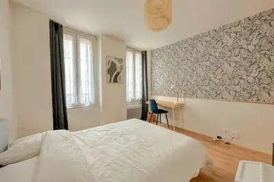 Un ou plusieurs lits dans un hébergement de l'établissement Studio Design Au Cœur de Bastille Paris Authentique