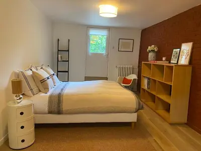 Un ou plusieurs lits dans un hébergement de l'établissement Appartement privé avec jardin