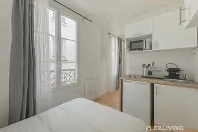 Cuisine ou kitchenette dans l'établissement Flexliving - Studio - Étienne Marcel