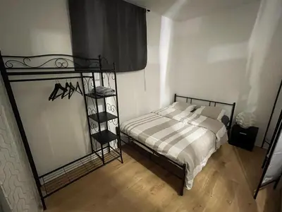 Un ou plusieurs lits dans un hébergement de l'établissement Jolie chambre proche de paris et sa périphérie