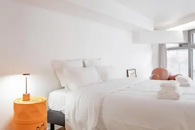 Un ou plusieurs lits dans un hébergement de l'établissement Modern loft - close to Eiffel Tower
