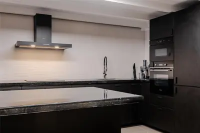 Cuisine ou kitchenette dans l'établissement Modern loft - close to Eiffel Tower