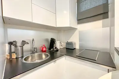 Cuisine ou kitchenette dans l'établissement Flexliving - Studio - Victor hugo