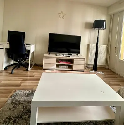 Télévision ou salle de divertissement dans l'établissement Appartement central Paris et confortable