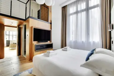 Un ou plusieurs lits dans un hébergement de l'établissement Exceptional apt with AC - 2BD-4P - Parc Monceau