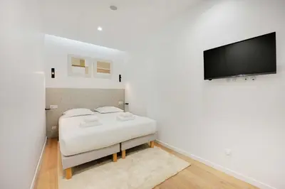 Un ou plusieurs lits dans un hébergement de l'établissement Charming apartment - 3BR-8P -Centre Pompidou