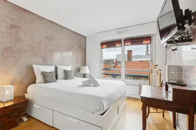 Un ou plusieurs lits dans un hébergement de l'établissement Appartement proche de la Tour Eiffel