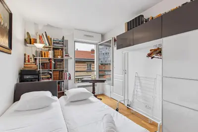 Un ou plusieurs lits dans un hébergement de l'établissement Appartement proche de la Tour Eiffel