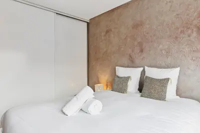 Un ou plusieurs lits dans un hébergement de l'établissement Appartement proche de la Tour Eiffel